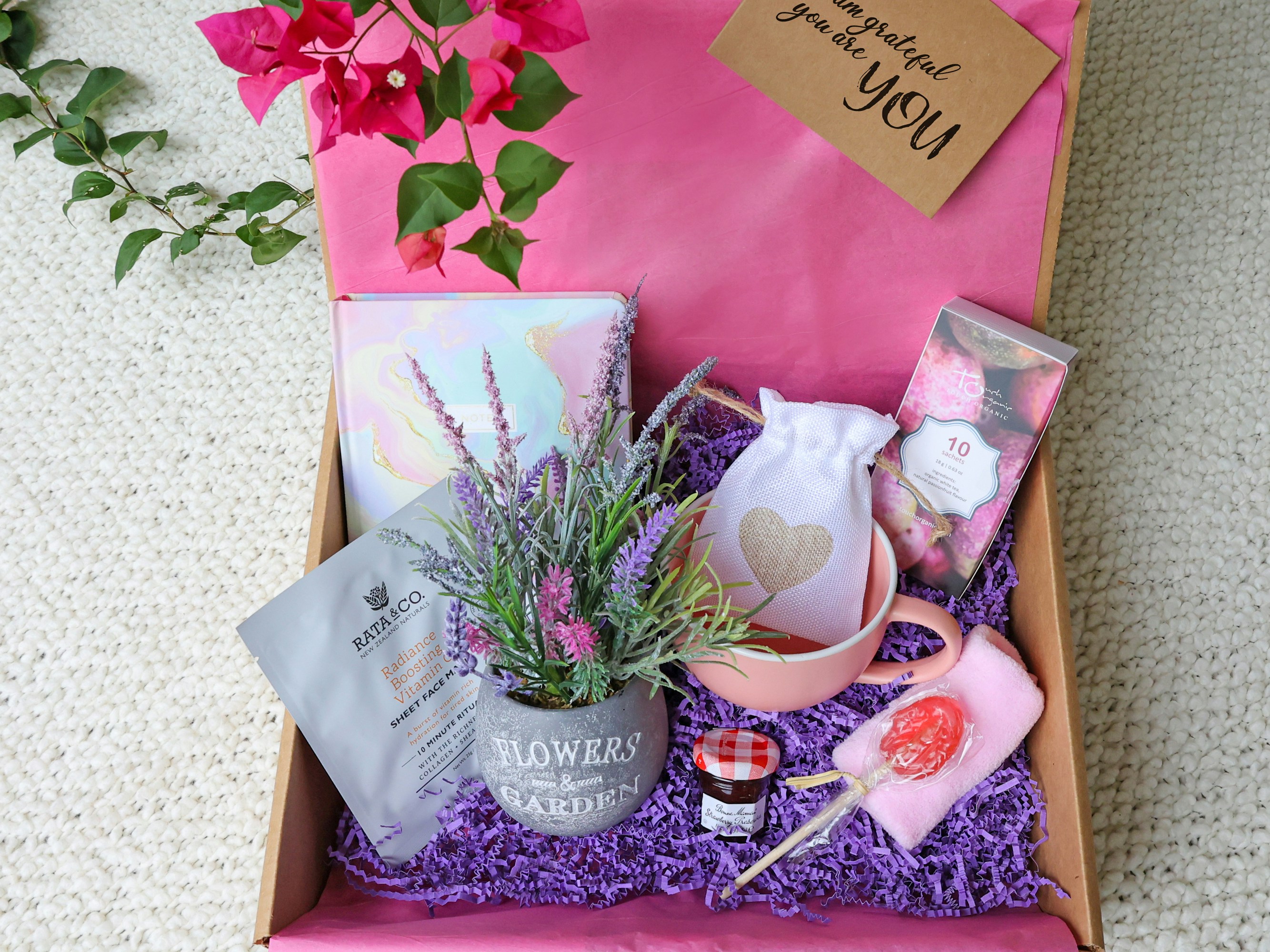 Appreciate You gift basket with snacks, chocolate, and local treats